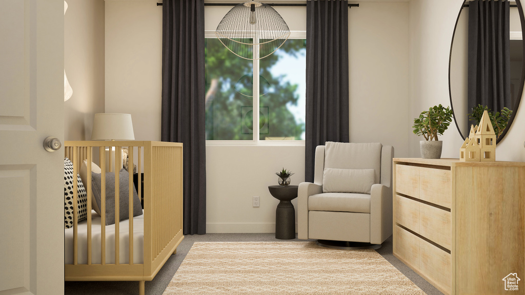 Bedroom featuring carpet flooring, a crib, multiple windows, and baseboards