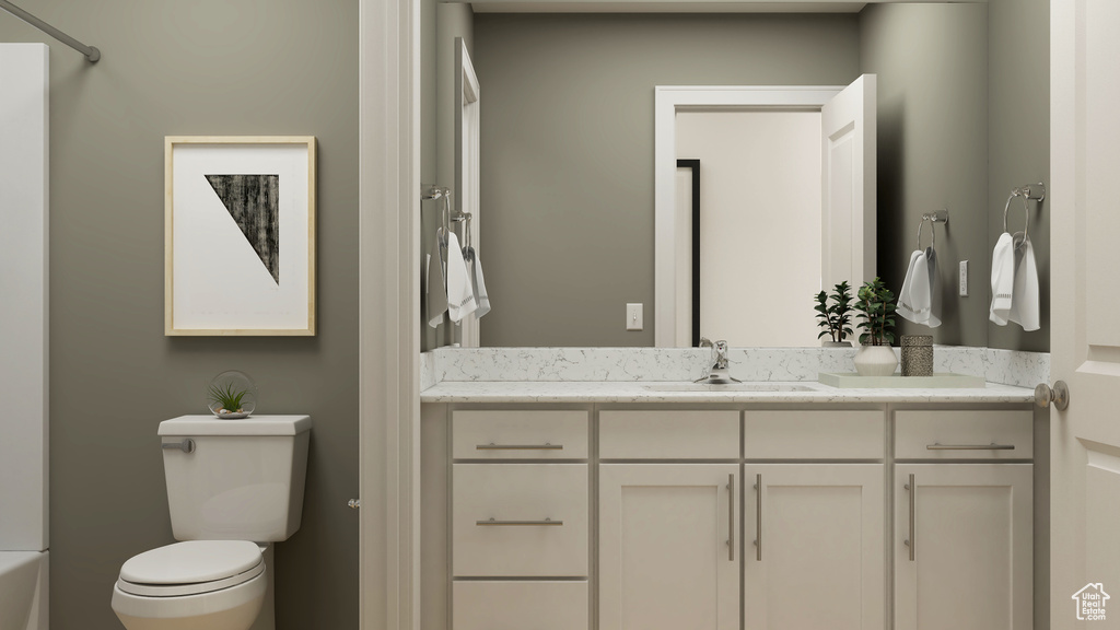 Bathroom with toilet, vanity, and a bath