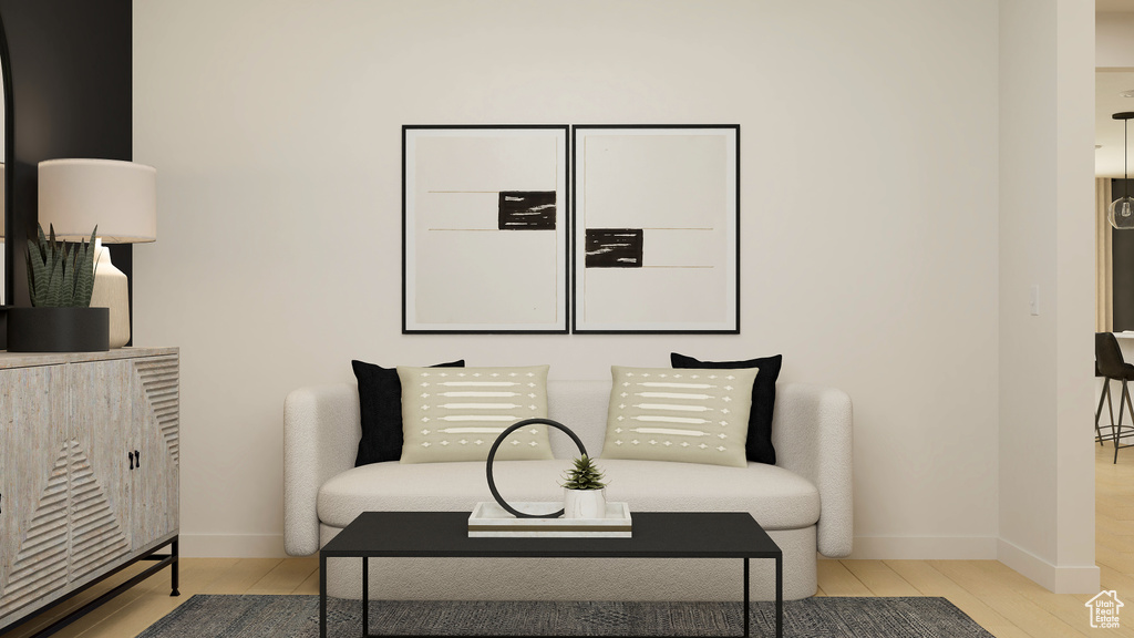 Living area featuring wood finished floors and baseboards