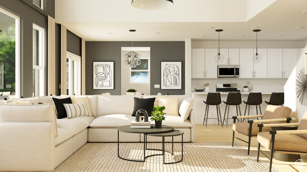 Living area featuring light wood-style flooring and recessed lighting