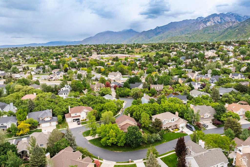 Aerial perspective of suburban area featuring a mountainous background