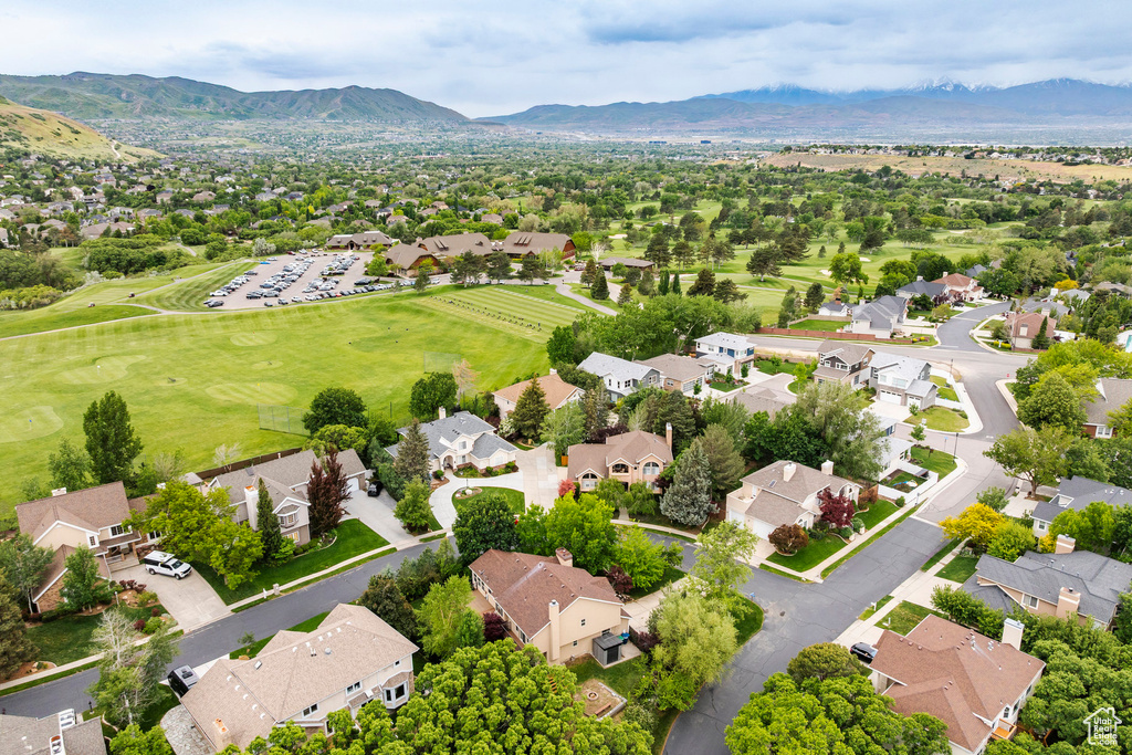 Aerial view of residential area featuring a mountainous background