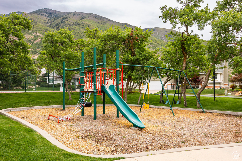 Community playground featuring a mountain view