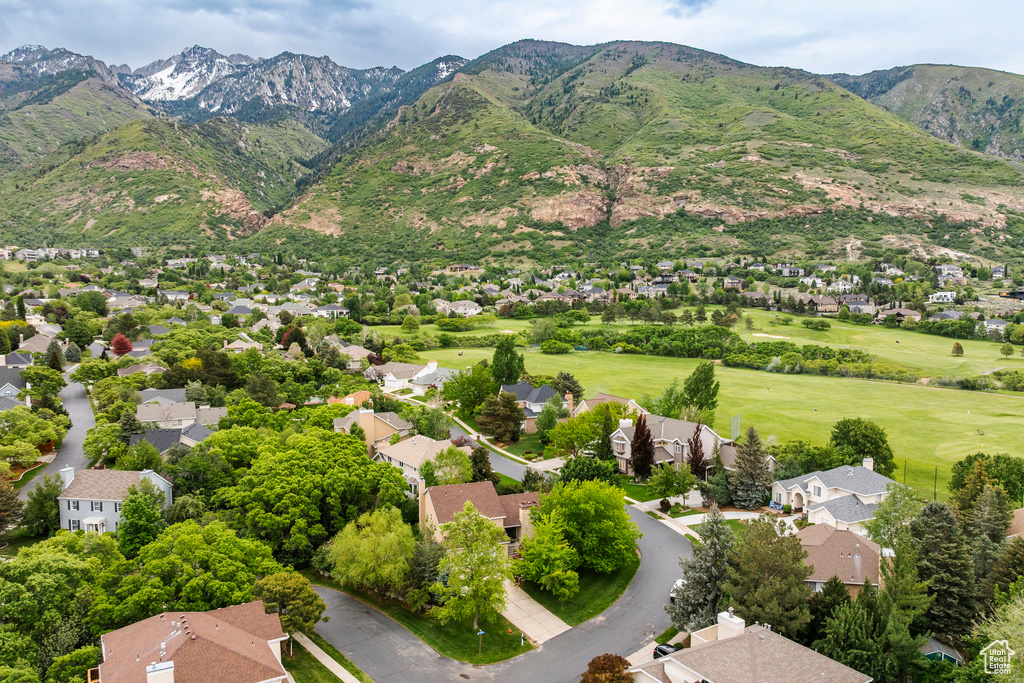 Aerial view of residential area featuring a mountain backdrop