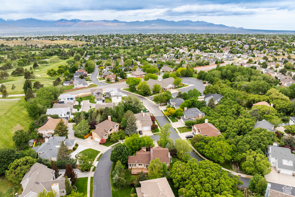Aerial perspective of suburban area with a mountainous background