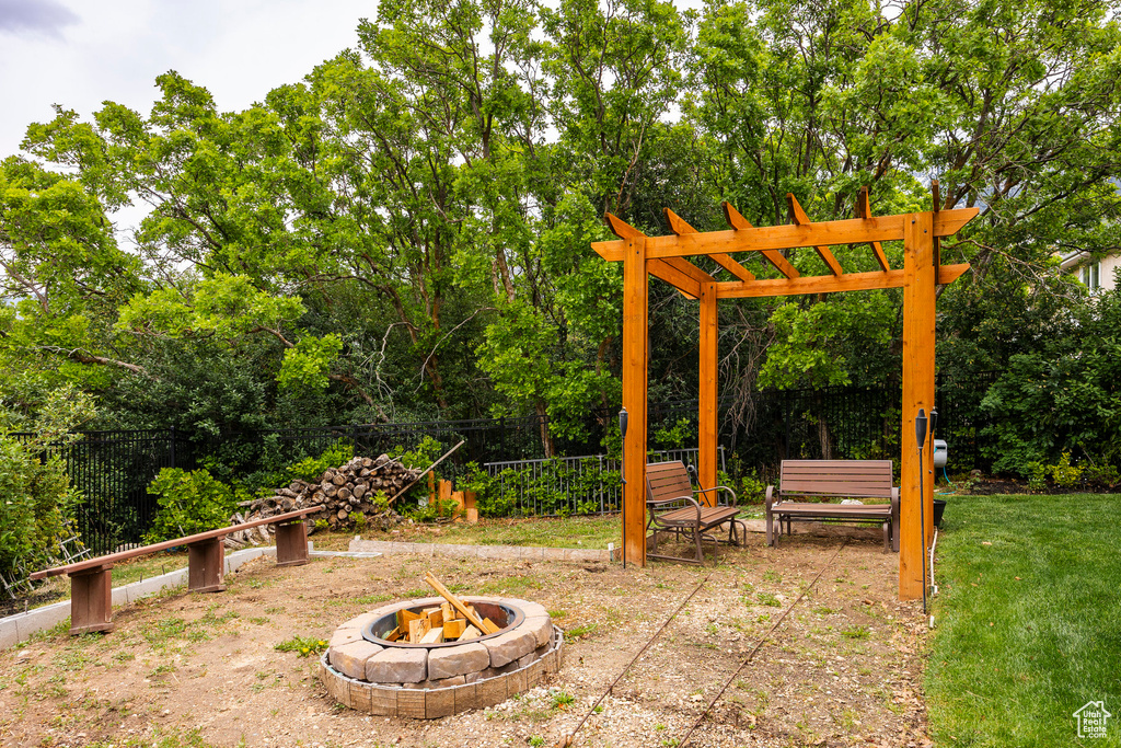 View of yard featuring a fire pit and a patio