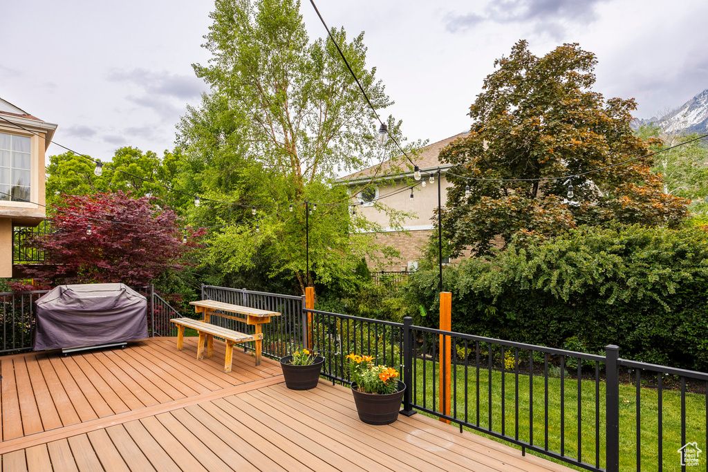 Deck featuring a grill and a yard