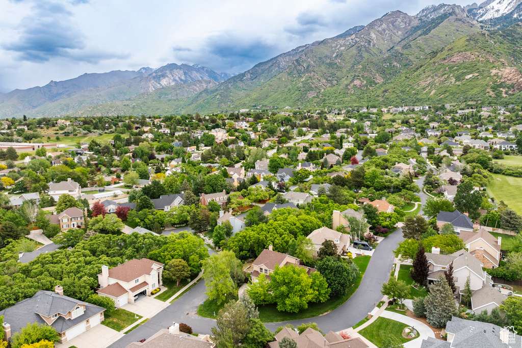 Aerial perspective of suburban area with a mountainous background