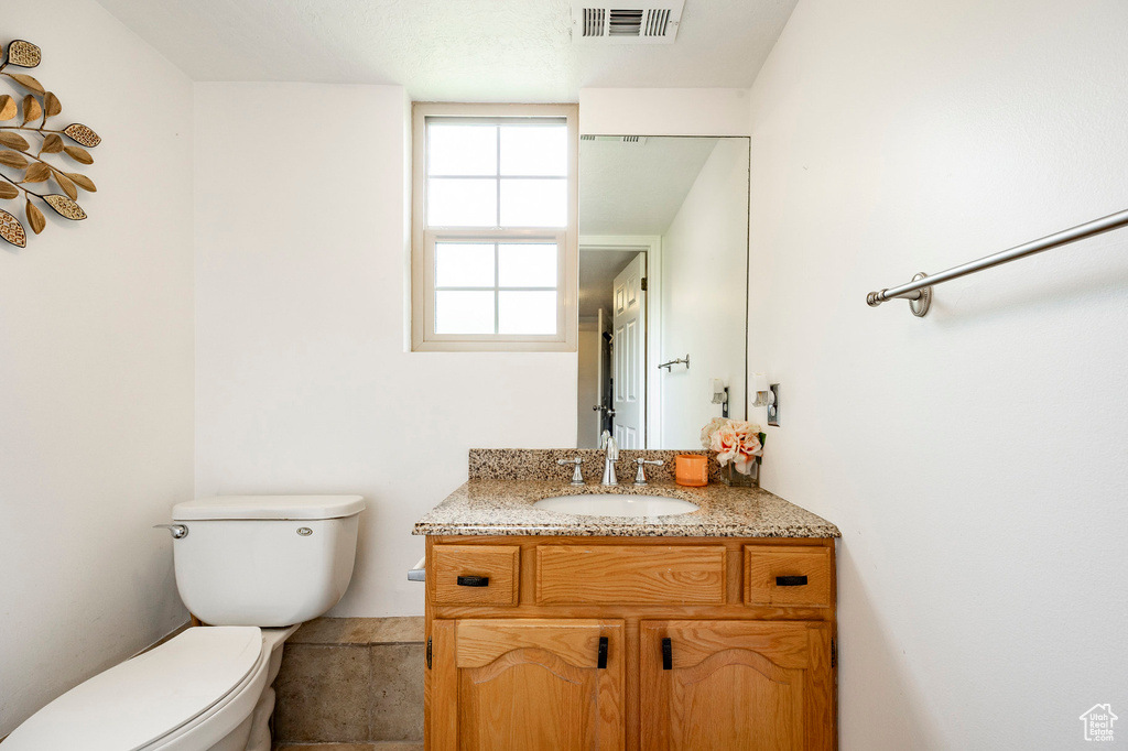 Bathroom with toilet and vanity