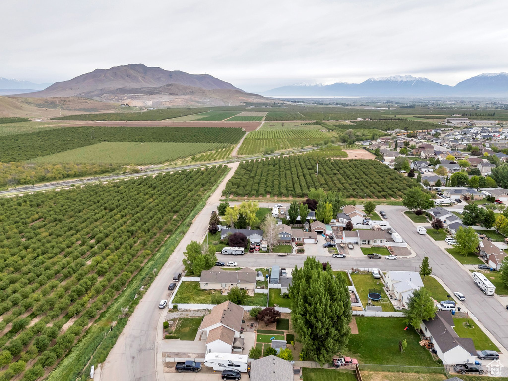 Overview of rural landscape with extensive farmland and a mountainous background