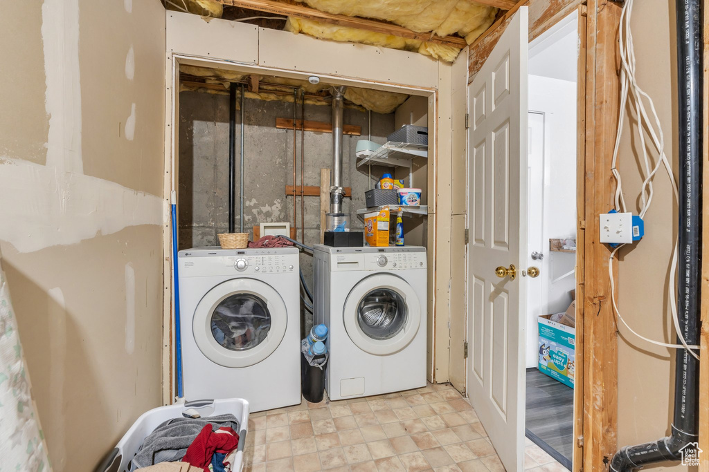 Washroom featuring washing machine and clothes dryer