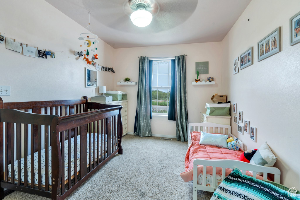 Bedroom featuring carpet floors, ceiling fan, and baseboards