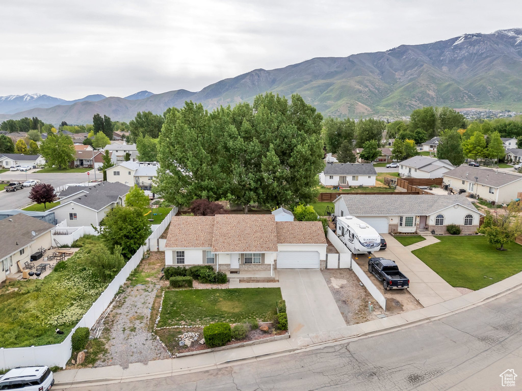 Aerial view of residential area featuring a mountain backdrop