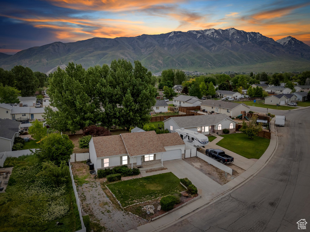 View of mountain backdrop featuring nearby suburban area