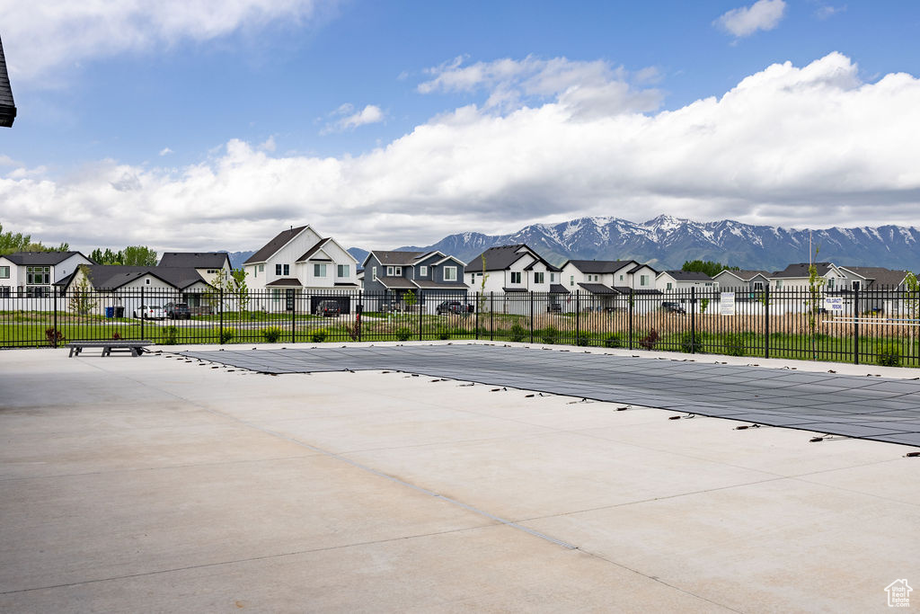 View of patio / terrace featuring a residential view and a mountain view