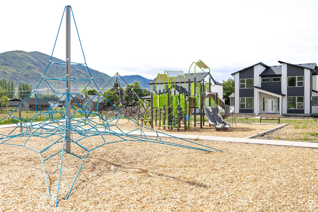 Community playground featuring a mountain view