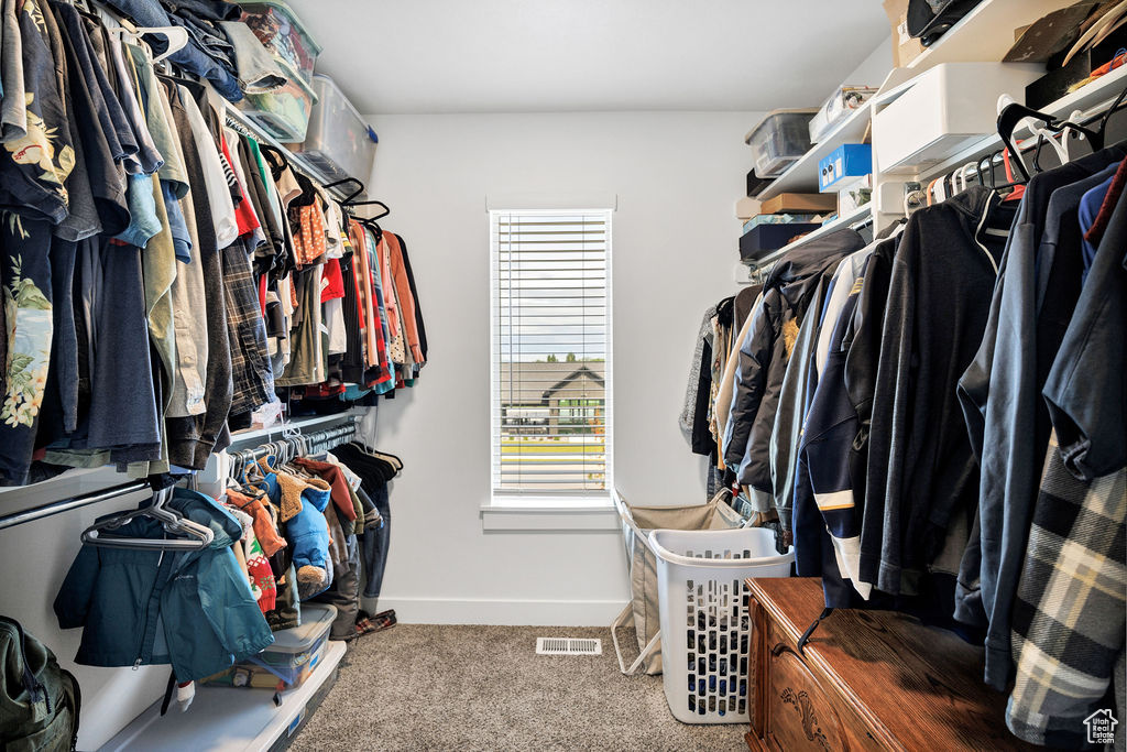 Walk in closet featuring carpet