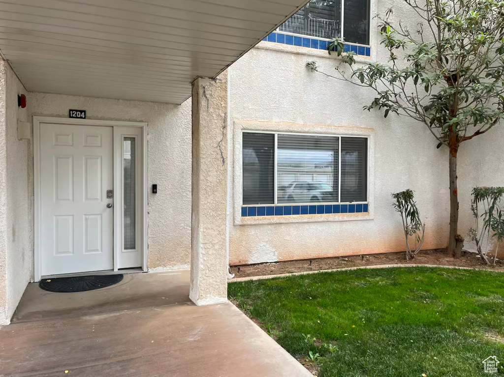 Property entrance with stucco siding