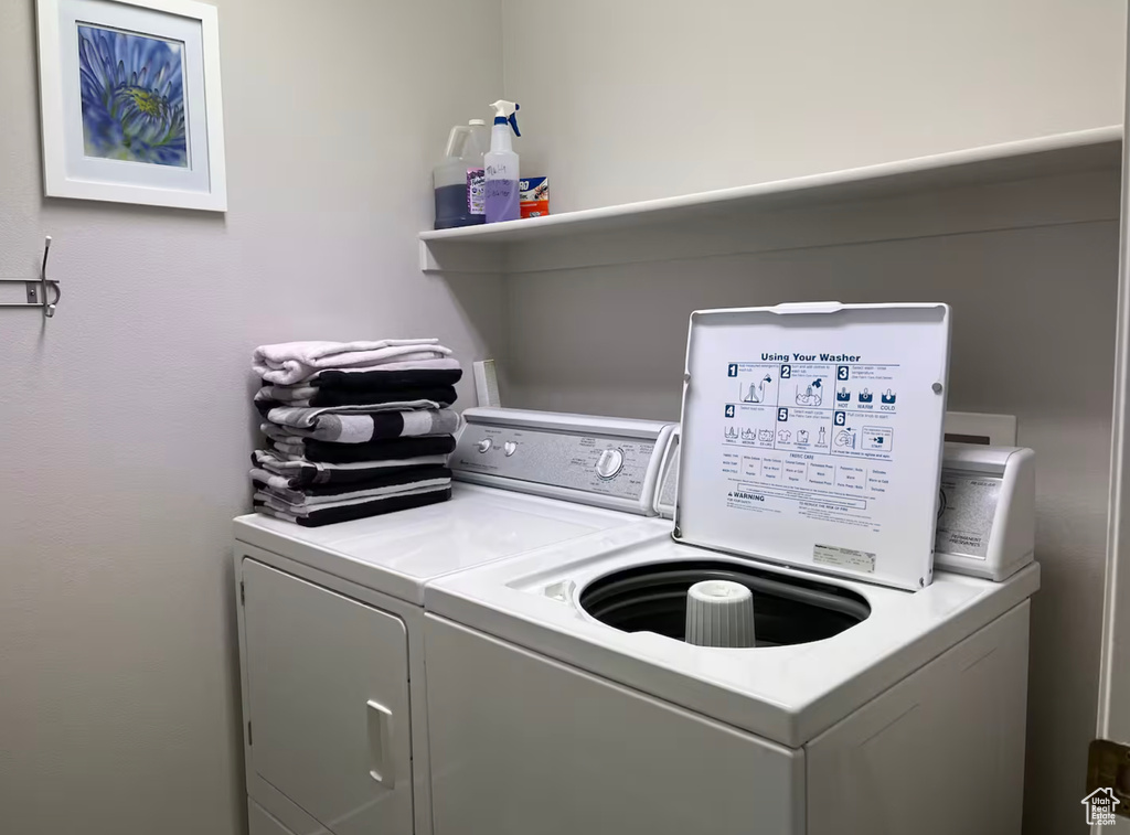 Laundry area with washing machine and clothes dryer