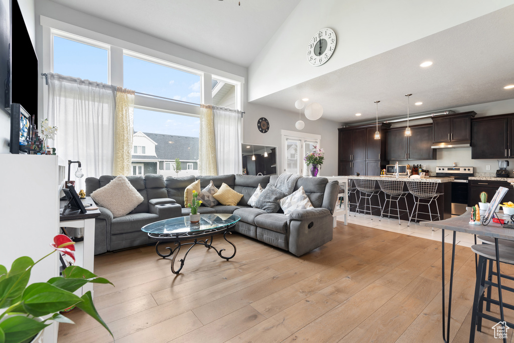 Living room featuring light wood-type flooring and recessed lighting