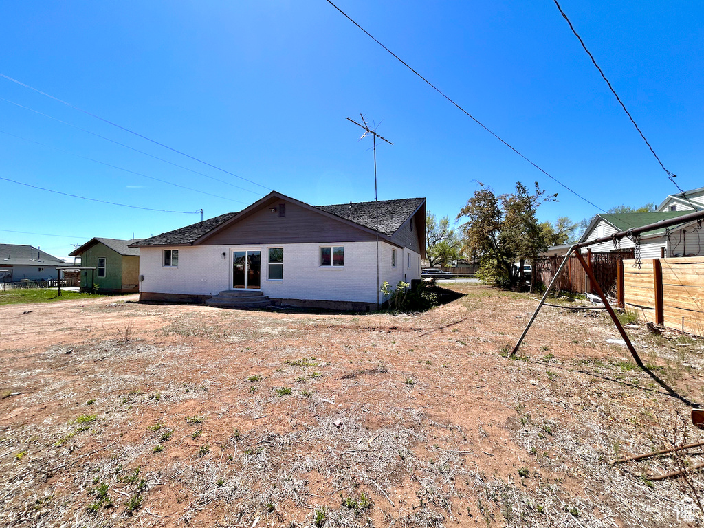 View of side of property featuring brick siding