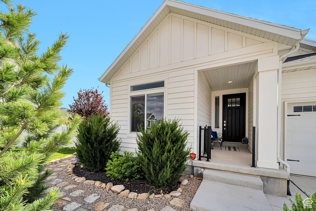 Doorway to property with board and batten siding