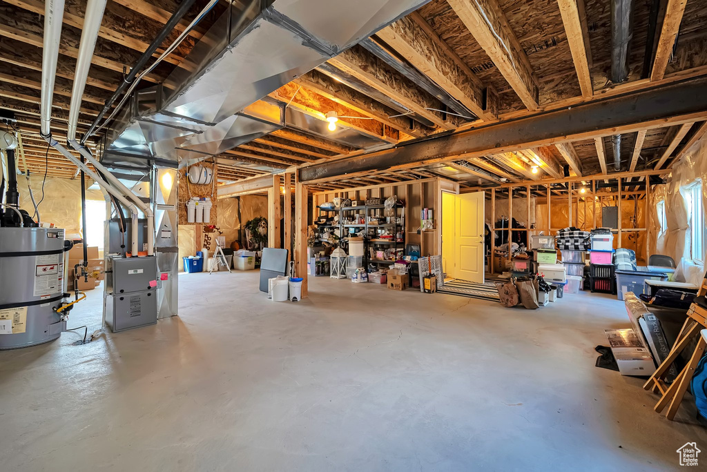 Below grade area with secured water heater and heating unit