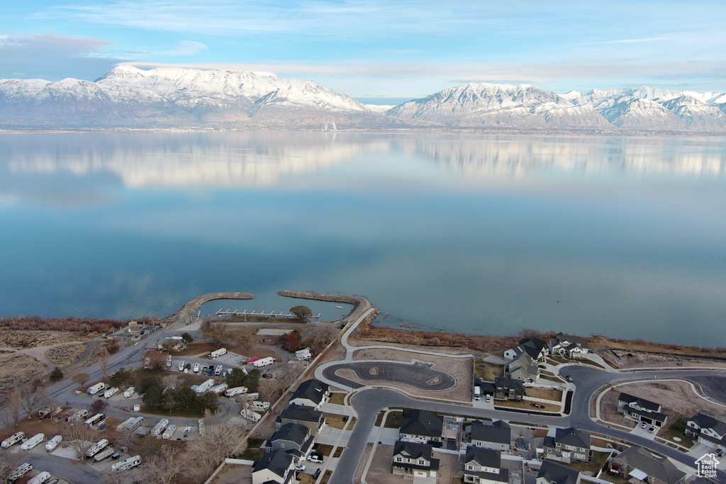 Aerial view of property's location with a water and mountain view