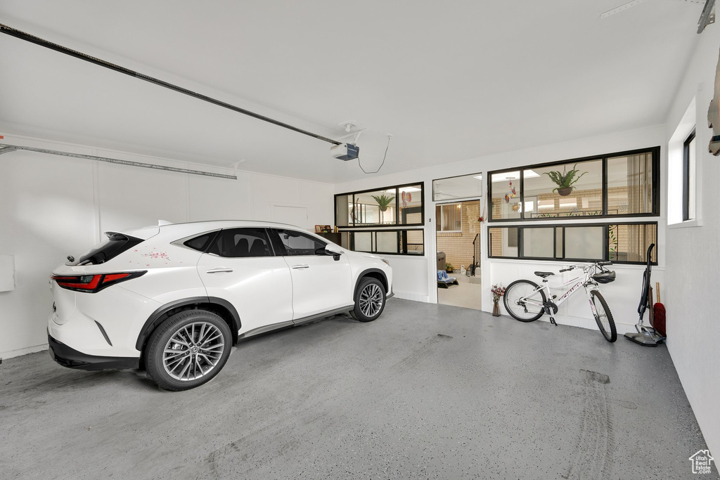 Garage featuring a garage door opener