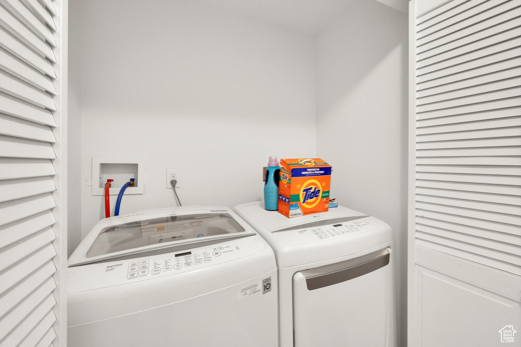 Washroom with washing machine and clothes dryer