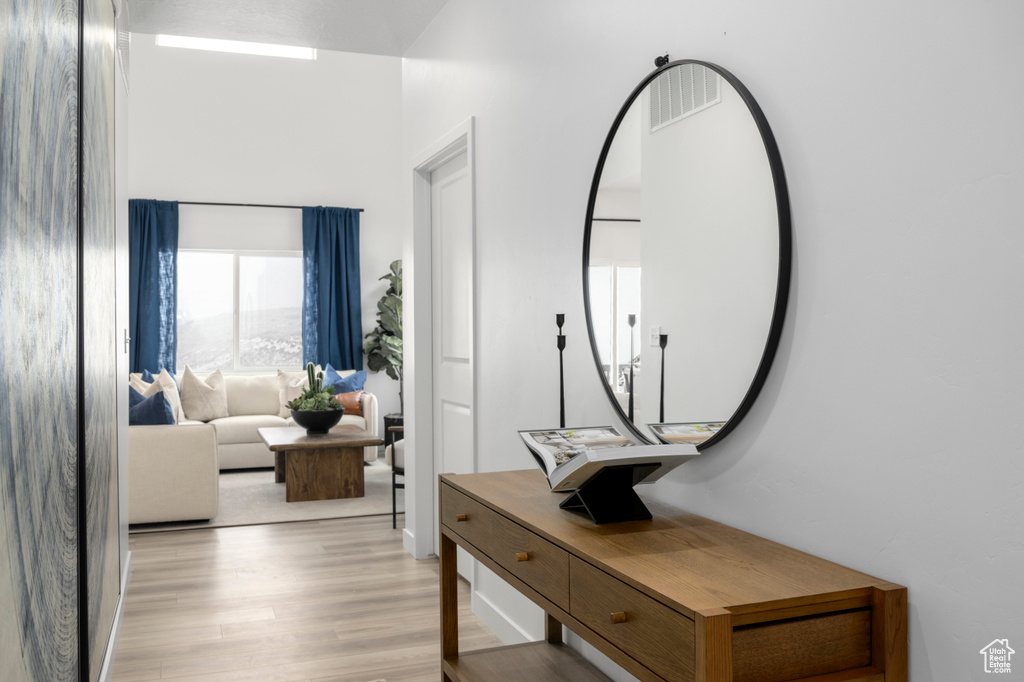 Hall featuring light wood finished floors