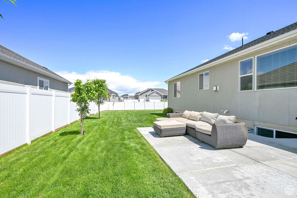 View of yard featuring outdoor lounge area and a patio