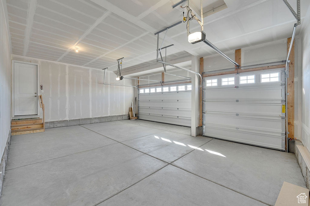 Garage featuring a garage door opener