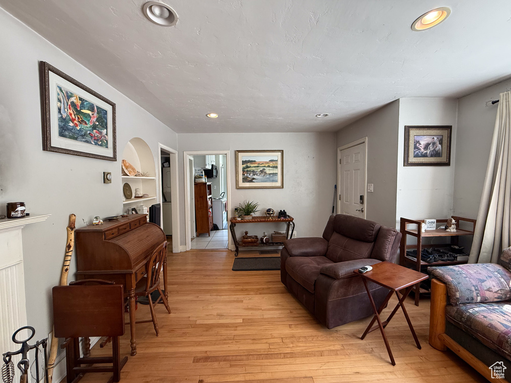 Living area featuring recessed lighting and light wood-style floors