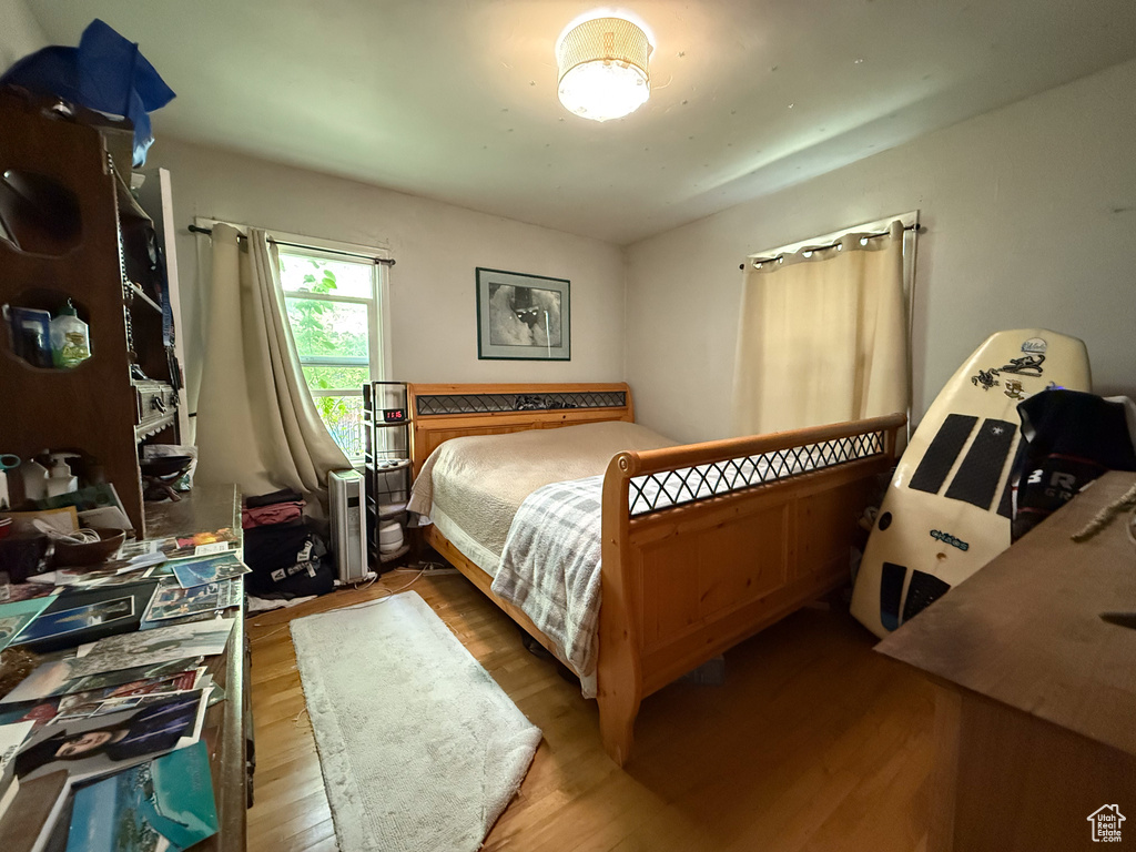 Bedroom with wood-type flooring