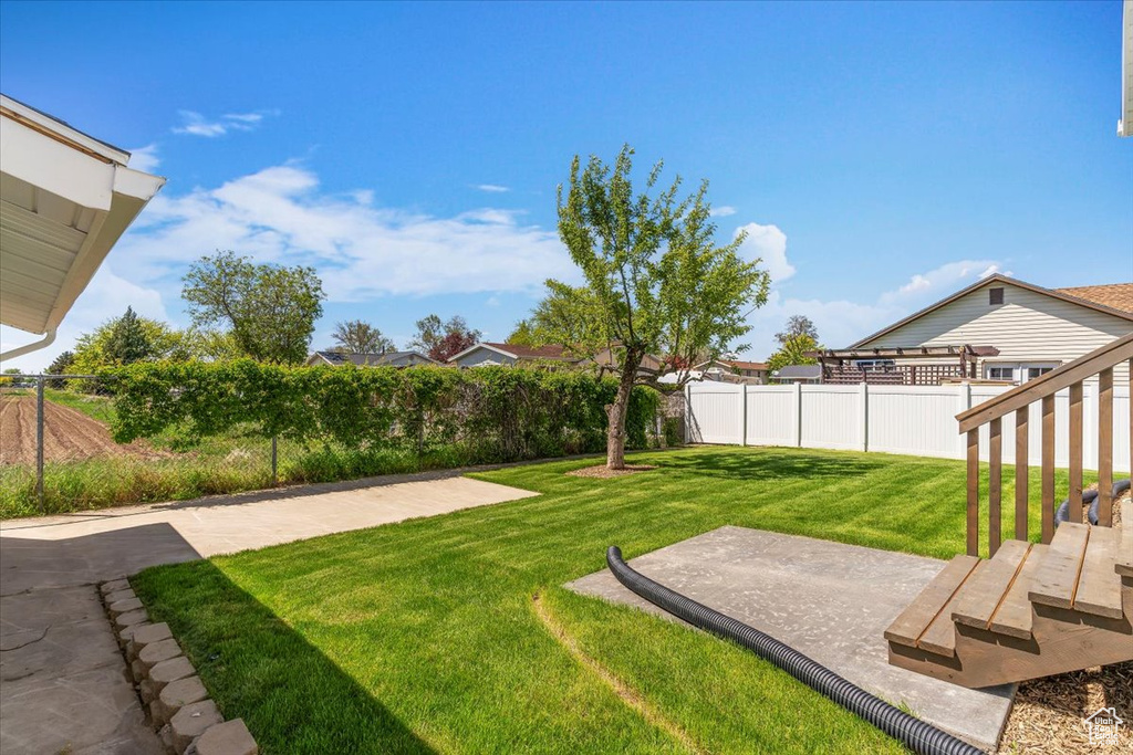 View of yard with a patio