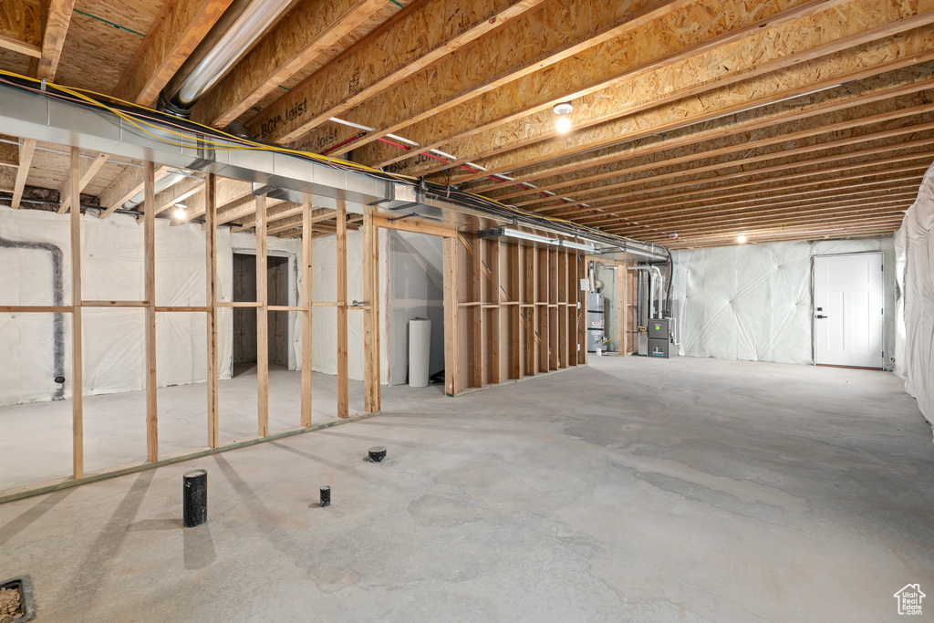 Unfinished below grade area with strapped water heater