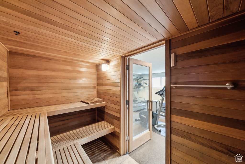 Sauna with wood walls and wooden ceiling