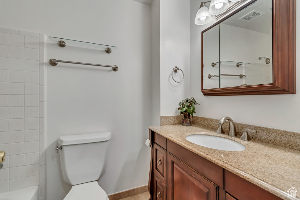 Bathroom with toilet and vanity