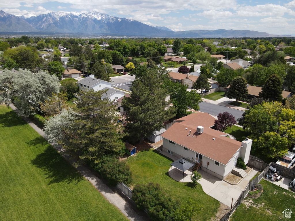 Aerial view of residential area featuring a mountain backdrop