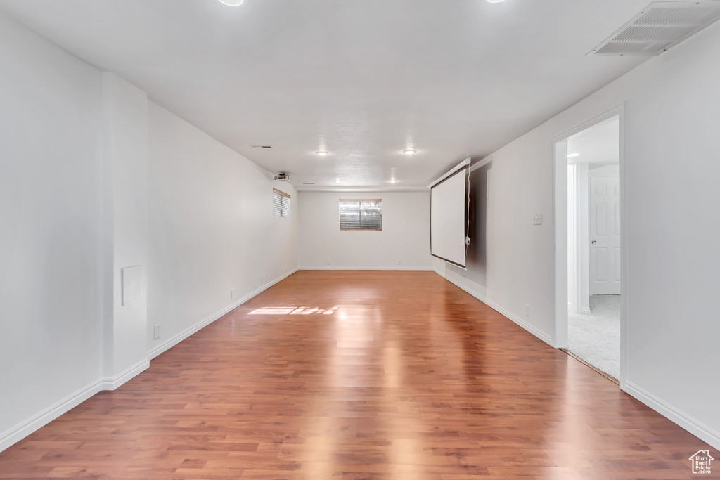 Unfurnished room with light wood-type flooring and baseboards