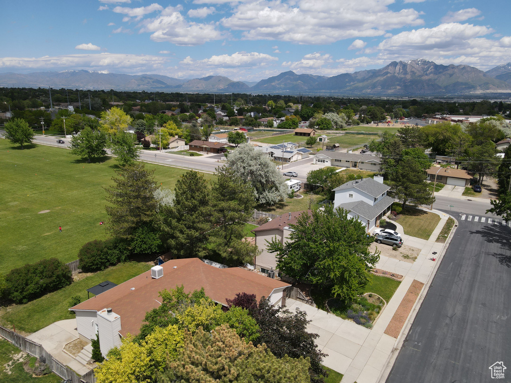 Aerial perspective of suburban area featuring a mountainous background
