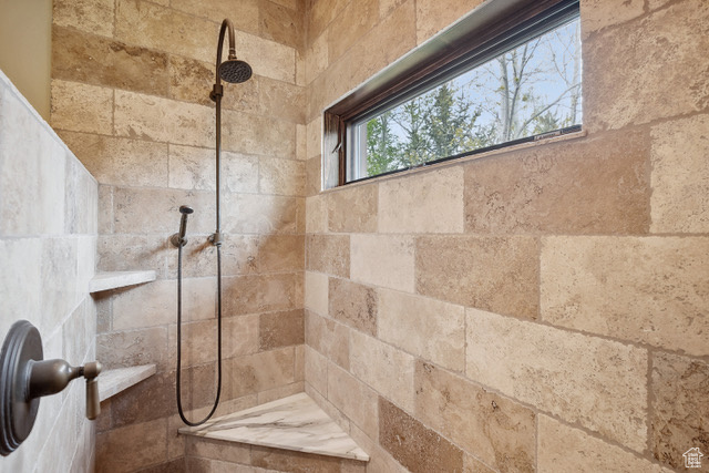 Full bath with tiled shower