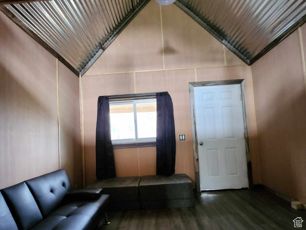 Unfurnished living room with wood finished floors, vaulted ceiling, and wood ceiling