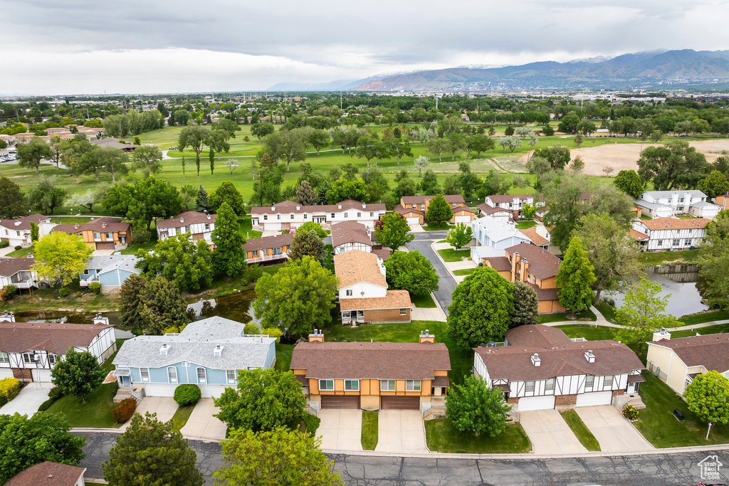 Aerial perspective of suburban area with a mountain backdrop