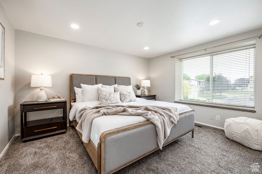 Bedroom with carpet flooring, baseboards, and recessed lighting
