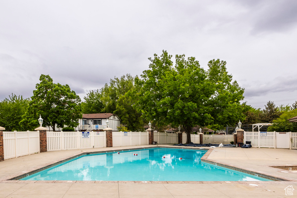Community pool featuring a patio area