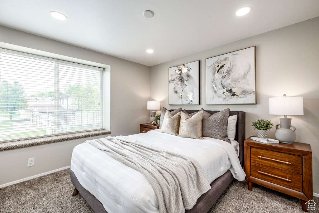 Carpeted bedroom featuring baseboards and recessed lighting