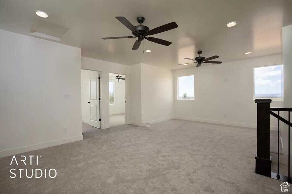Unfurnished room with recessed lighting, carpet flooring, baseboards, and ceiling fan