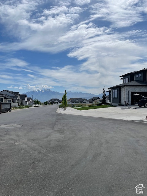 View of asphalt road with a residential view